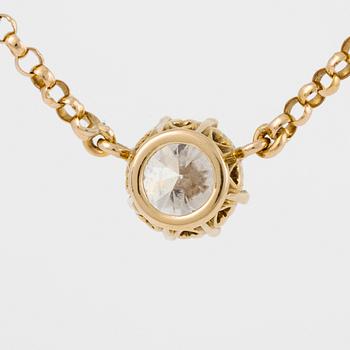 Hängsmycke 18K guld med en rund briljantslipad diamant.