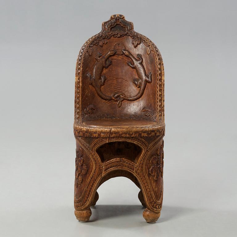 Knut Fjaestad, an Art Nouveau folk art sculptured pine chair, Sweden early 1900's.