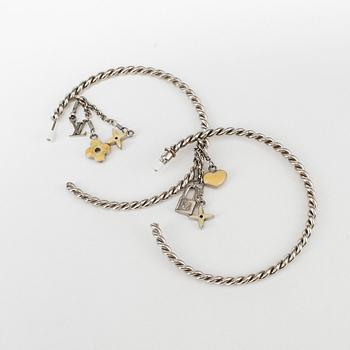 LUOIS VUITTON, a pair of charm earrings.