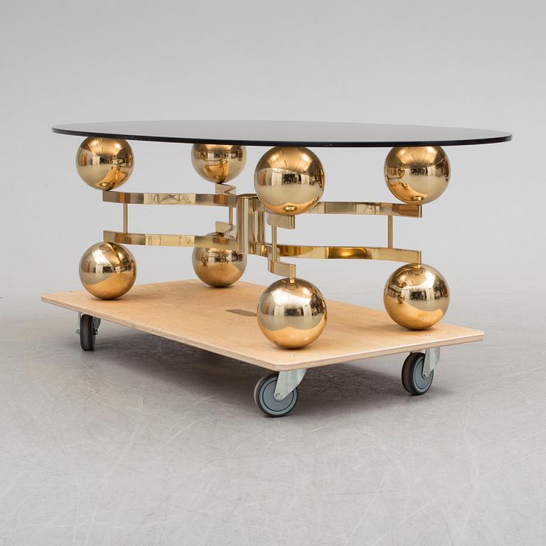 A French 1970s brass and glass coffie table.