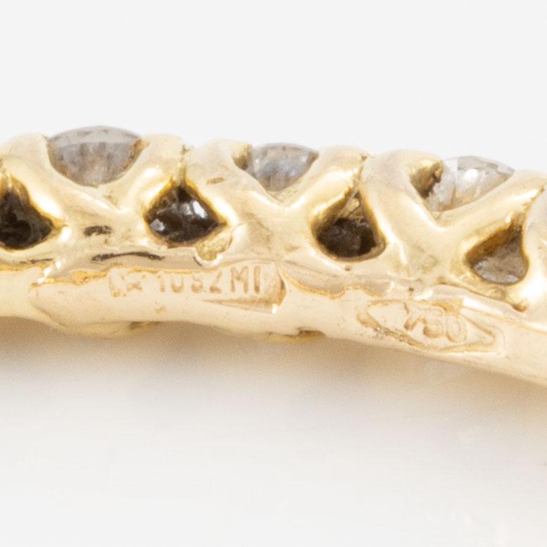 Rings, three pieces, set with brilliant-cut diamonds.