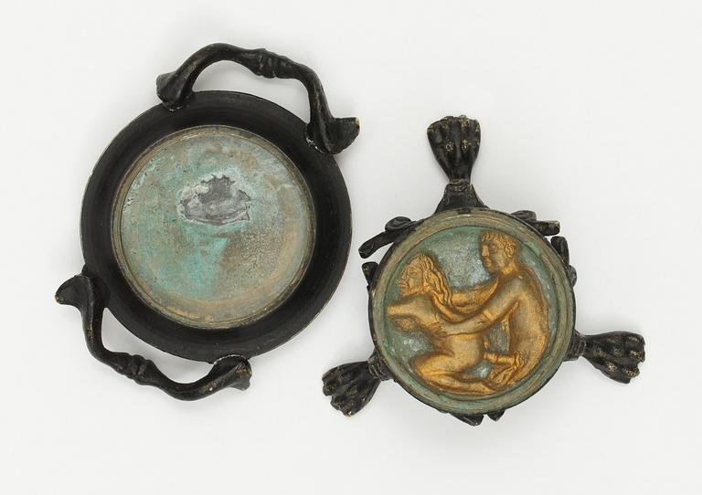 A bronze salt cellar.