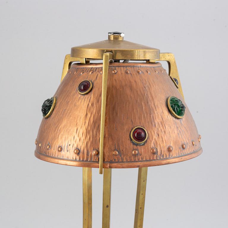An early 20th century, brass and copper table lamp.