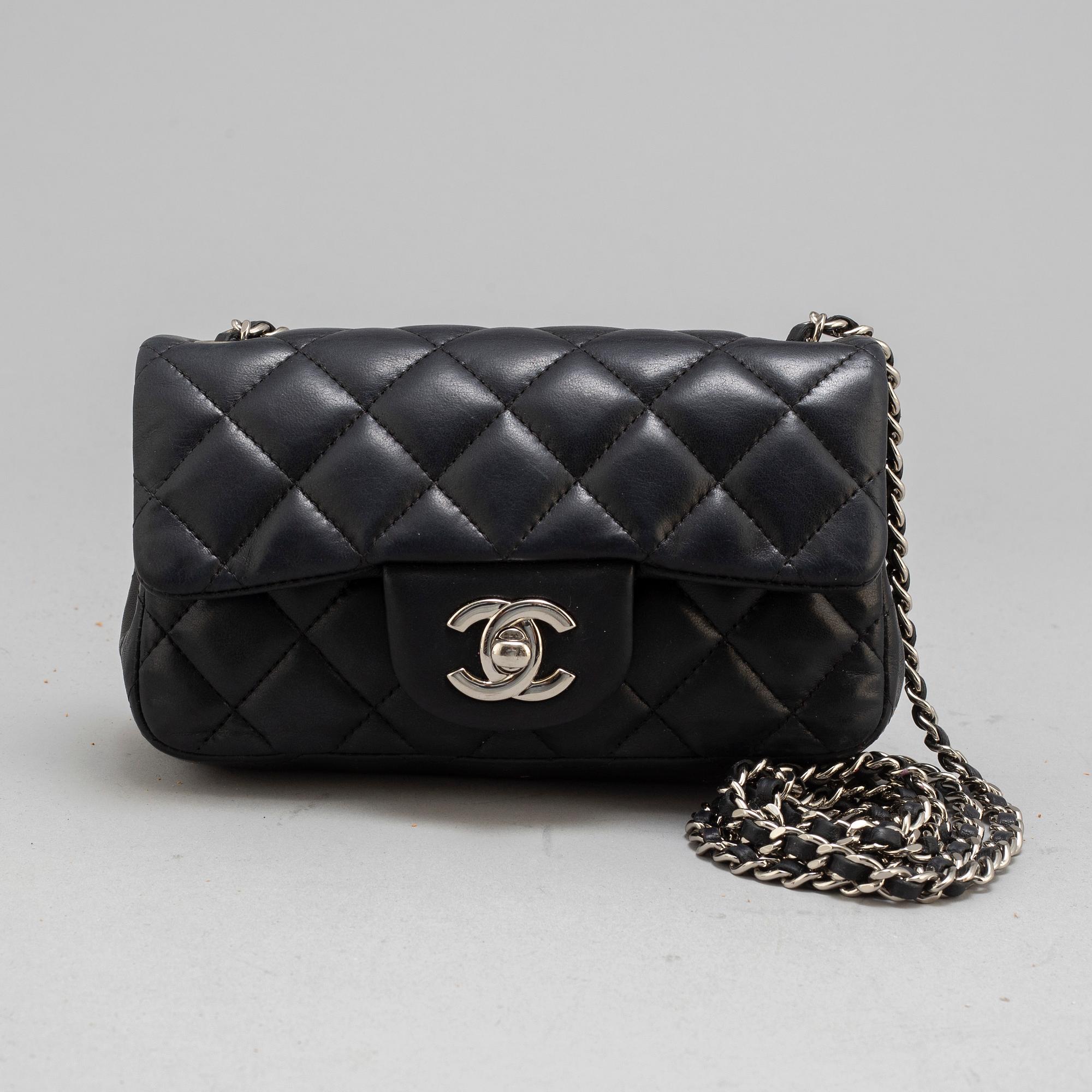 CHANEL, a black leather 'Extra mini flap bag' 2012-13.