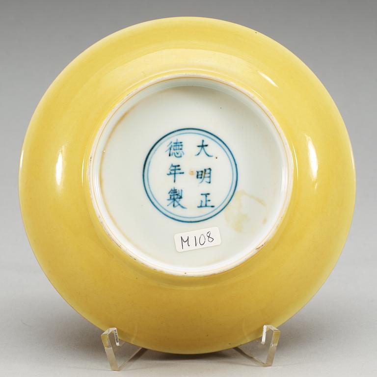 A yellow glazed dish, Ming dynasty with Zhengdes six character mark and of the period.
