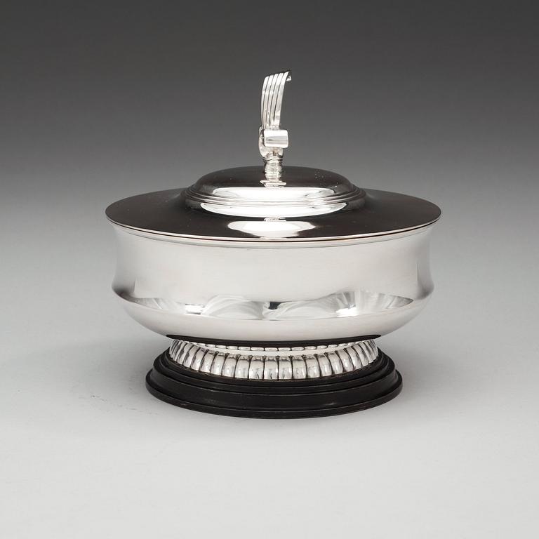 A C.G. Hallberg lidded bowl, Stockholm 1934, mounted on a black lacquered stand.
