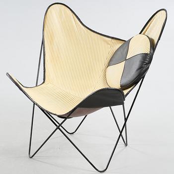 A chair, so called bat chair, made in the mid 20th century.