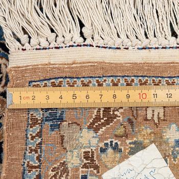 A semi-antique Nain carpet, part-silk, c. 261 x 175 cm.
