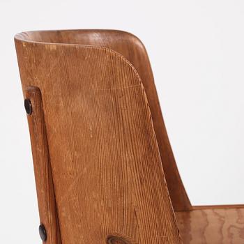 Axel Einar Hjorth, a pair of "Lovö" stained pine armchairs, Nordiska Kompaniet 1930s.