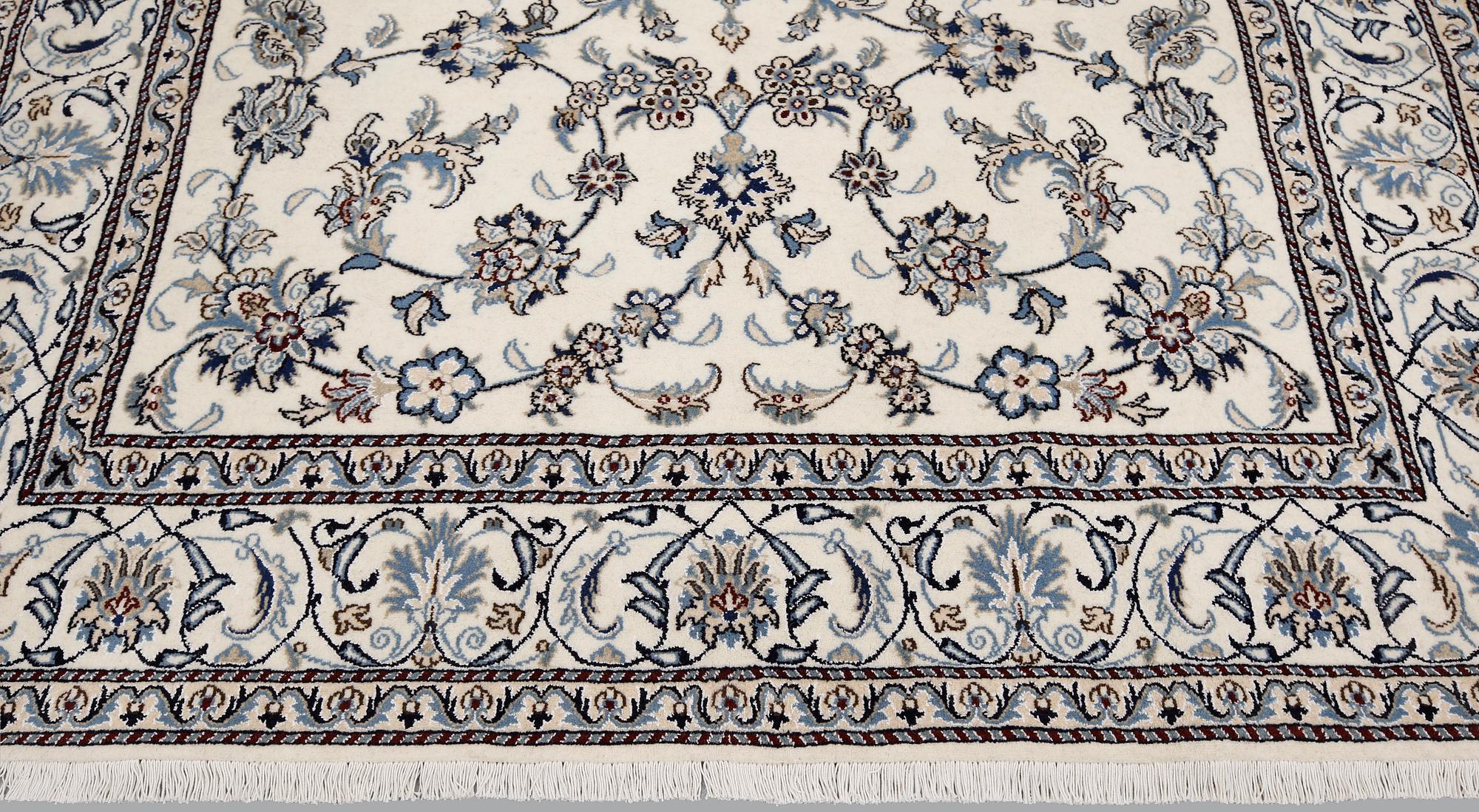 A part silk Nain carpet, ca 305 x 198 cm.