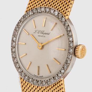 A Chopard wrist watch in 18K gold set with eight-cut diamonds.