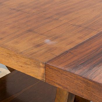 A french art deco dining table with extra boards.