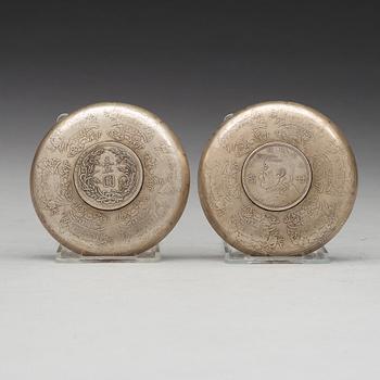 A set of two coasters with Chinese silver coins, 20th Century.