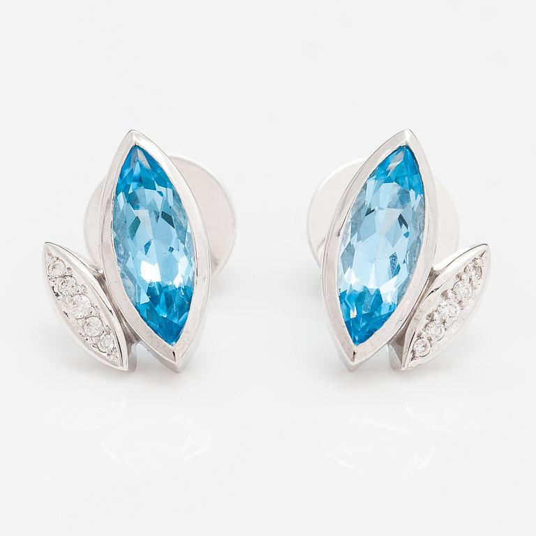 A pair of 14K white gold earrings with topazes and diamonds ca. 0.10 ct in total.