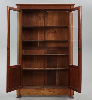 A French Empire mahogany and gilt-bronze mounted bibliothèque, early 19th century.