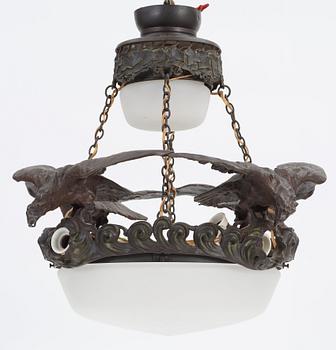 A Swedish Art Nouveau patinated bronze and patinated metal hanging lamp, reportedly designed by Ruth Milles.