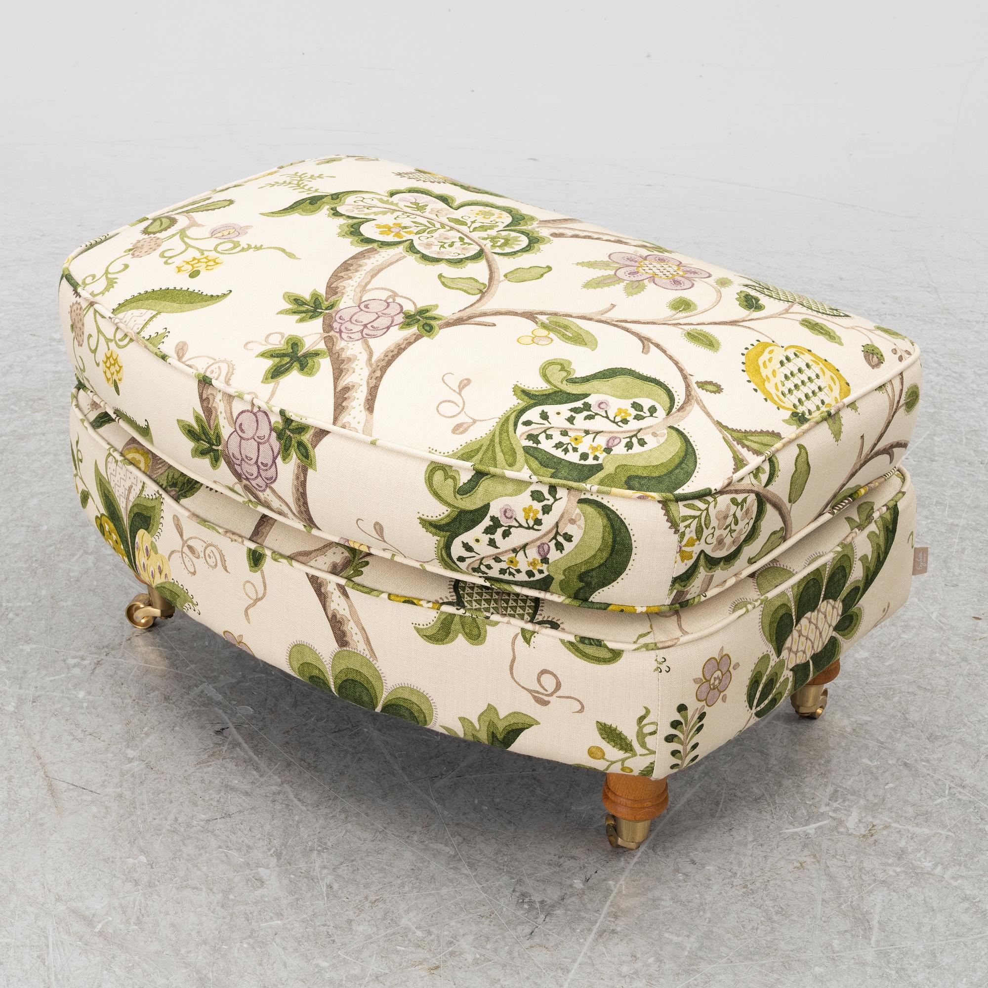 A 'Howard' armchair with footstool, Englesson.