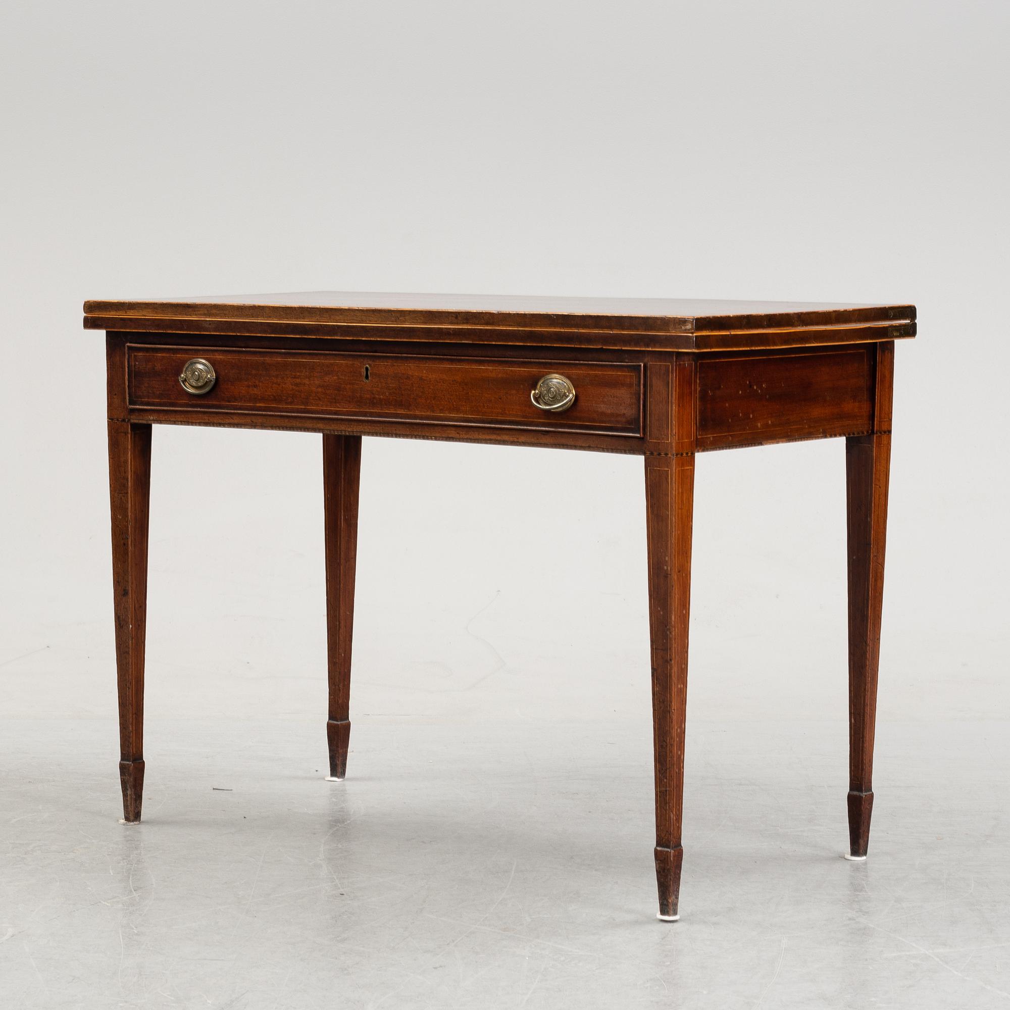 A mid 19th Century mahogany card table.