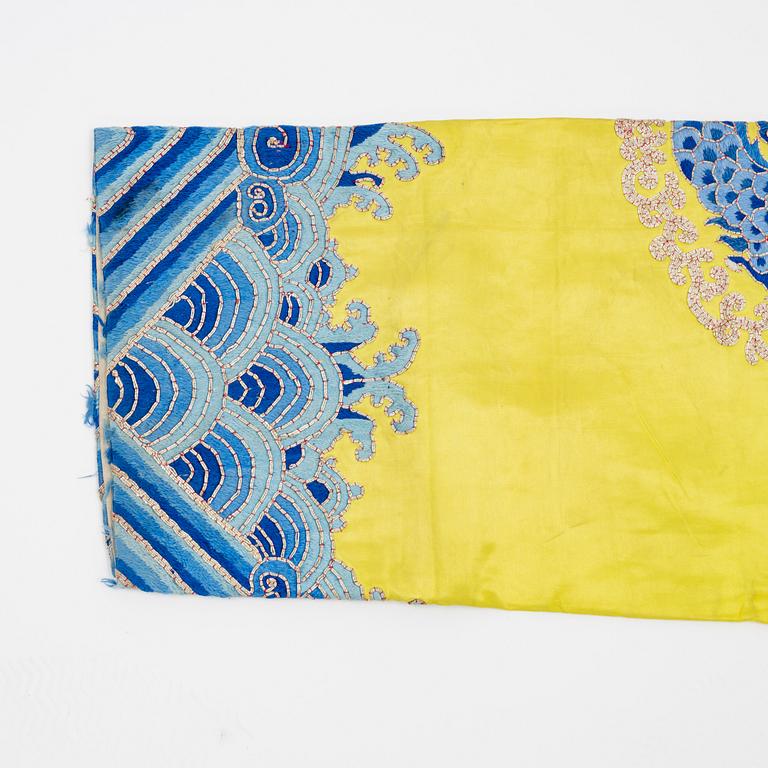 A yellow-ground embroidered silk robe, 20th century.