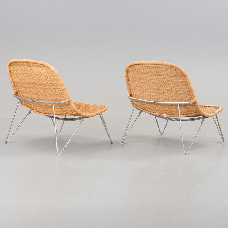 a pair of 21h Century lounge chairs designed by James Irvine, by IKEA.