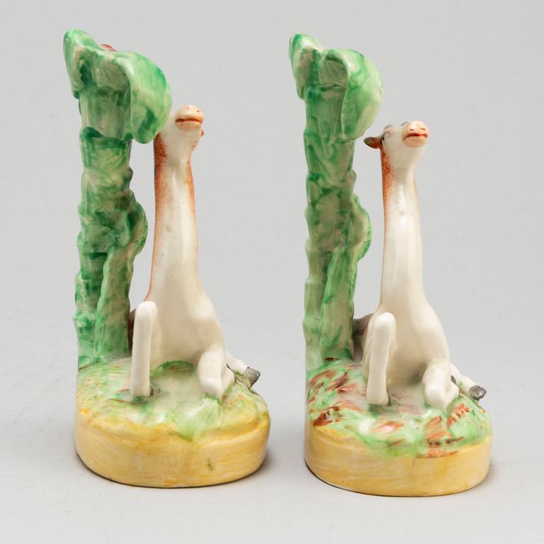 A pair of ceramic figures of giraffes, England, presumably Staffordshire, 19th century.