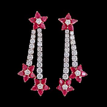 1171. A pair of ruby and diamond earrings, 11.70 cts. resp. 5.20 cts, 1980's.