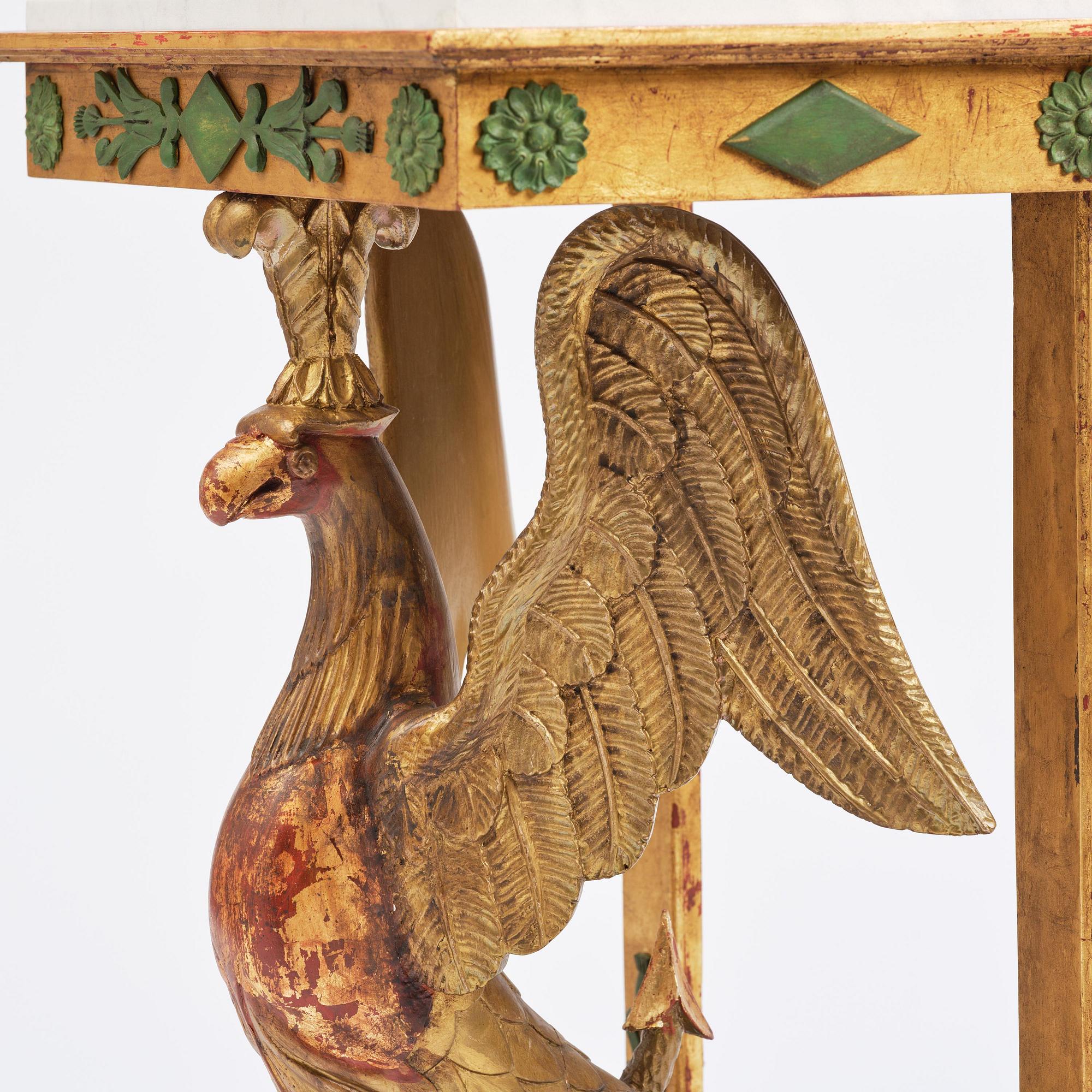 A pair of giltwood console tables, Empire-style incorporating older elements.
