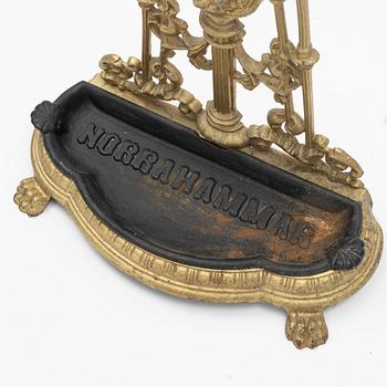 A cast iron umbrella stand from the first half of the 20th century.