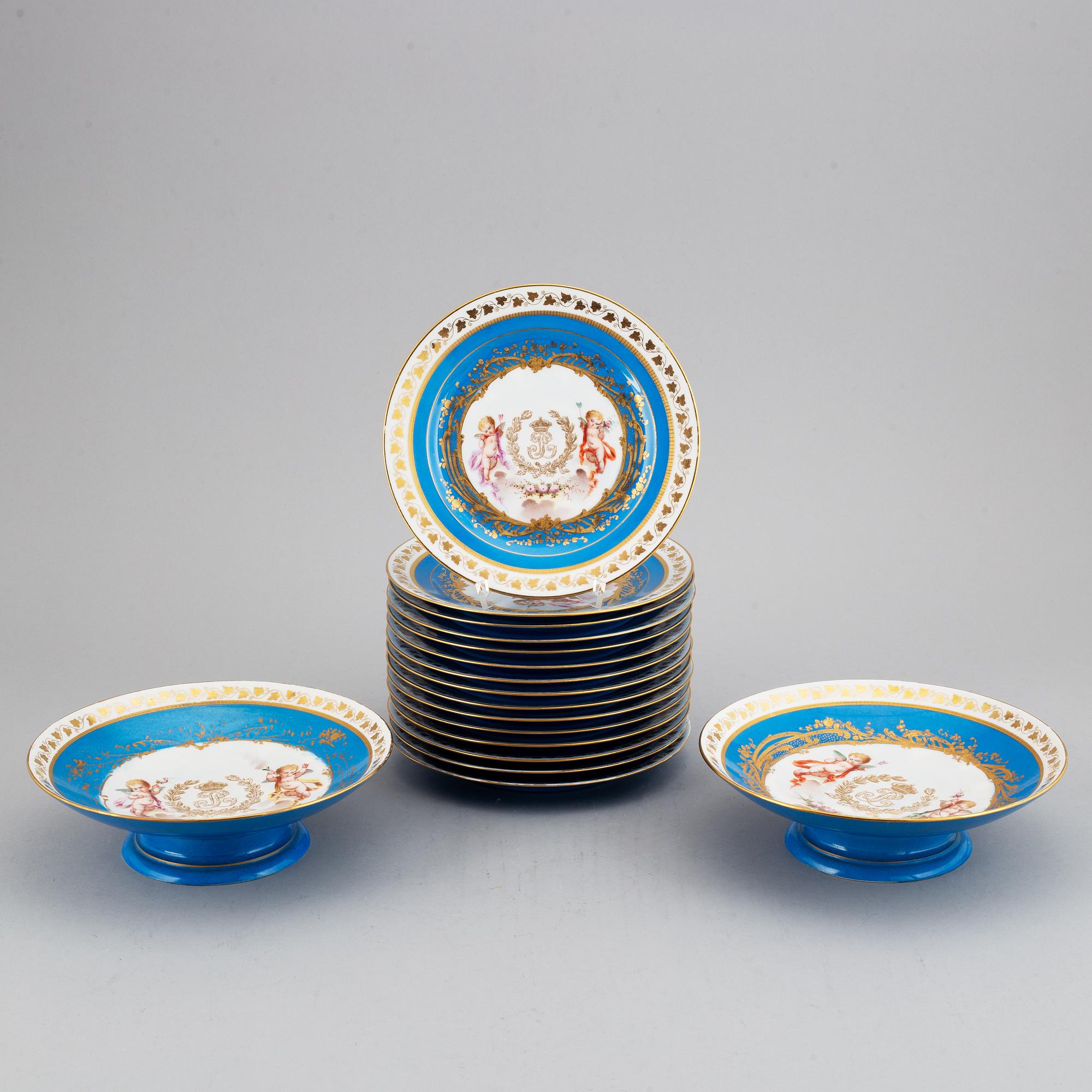 A set with two porcelain tazzas and 15 plates, France, "Sevrès", late 19th Century.