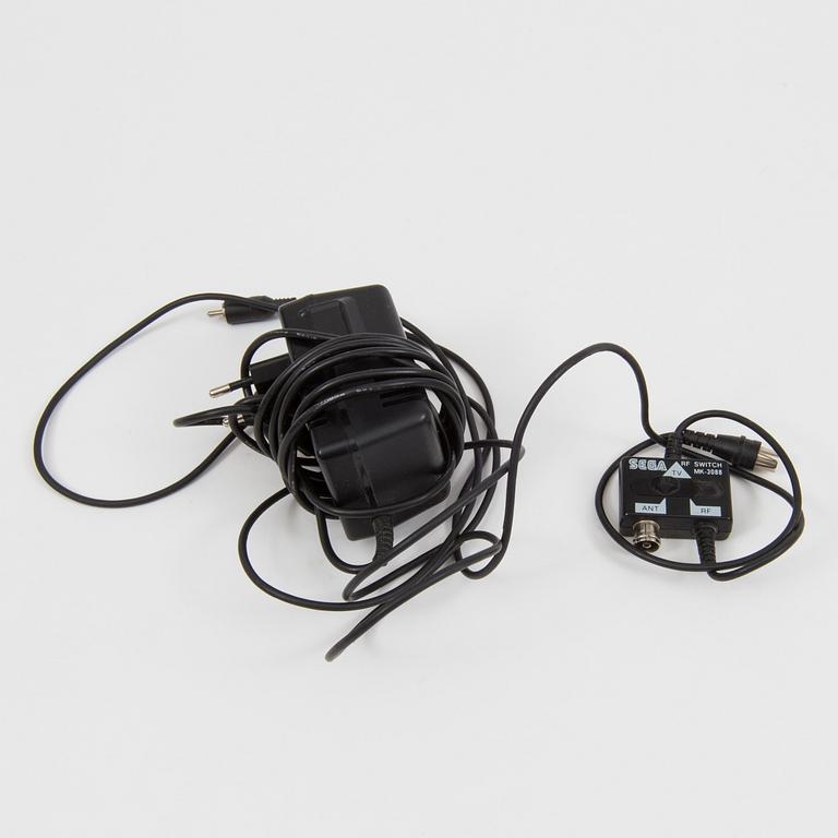 A "Sega Mega Drive" and nine games, 1990.s.