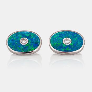 1139. A pair of Quinn Scheurle opal and diamond cufflinks.