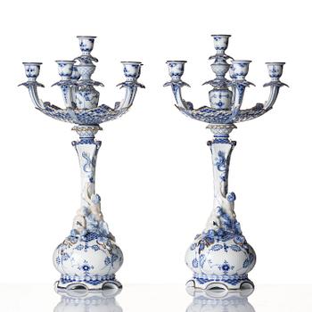 A pair of Royal Copenhagen 'Musselmalet' / 'blue fluted full lace' six-light candelabras, Denmark, 1898-1923.