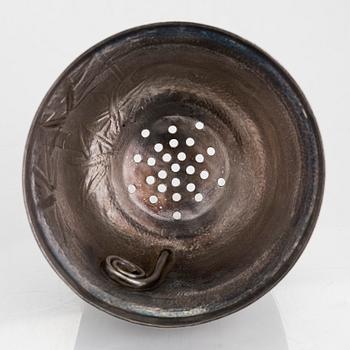 A silver cocktail shaker with strainer, Japan, first half of the 20th century.