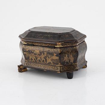 A Chinese lacquered tea caddy with pewter inserts, Qing dynasty, 19th century.