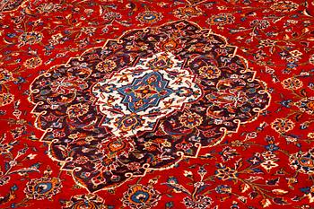 A Keshan rug, signed, 409 x 308 cm.