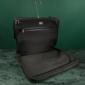 A Garment bag by Louis Vuitton.
