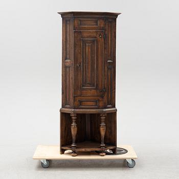 A Boroque corner cabinet, first half of the 18th Century.