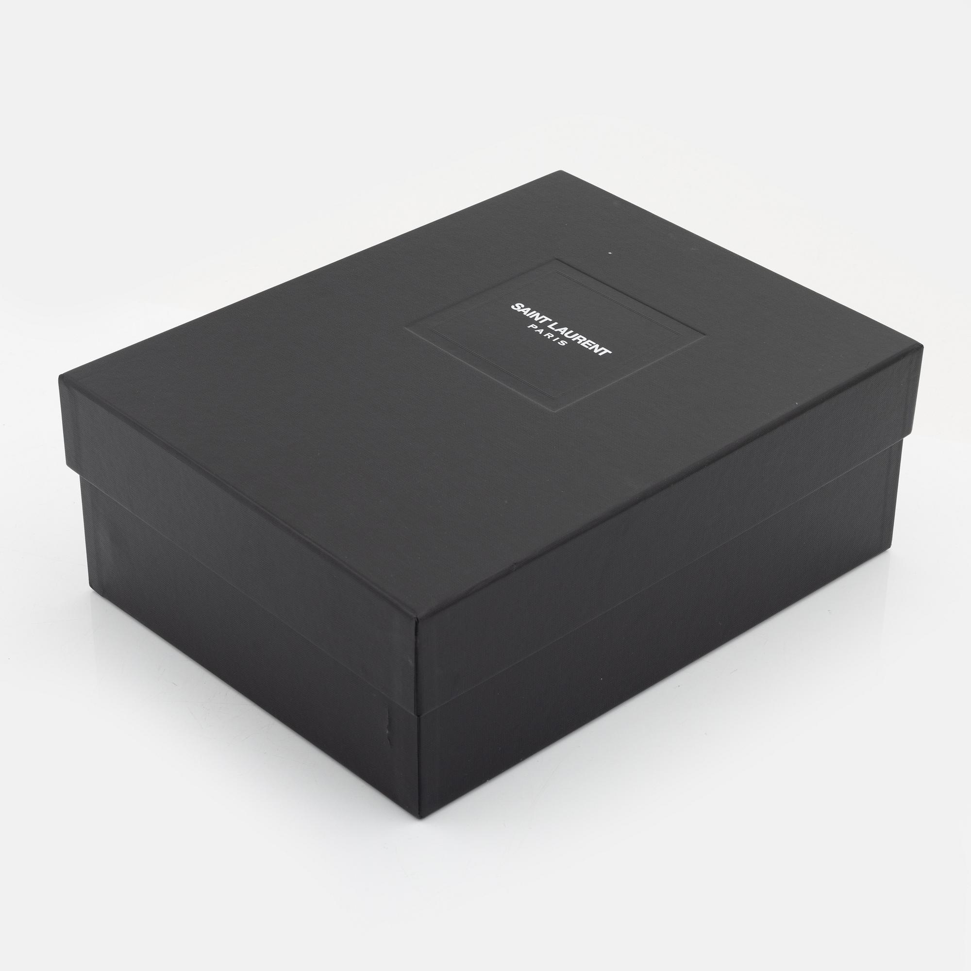 Yves Saint Laurent, a pair of black leather and studs boots, size 38.