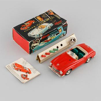 A Schuco toy car.