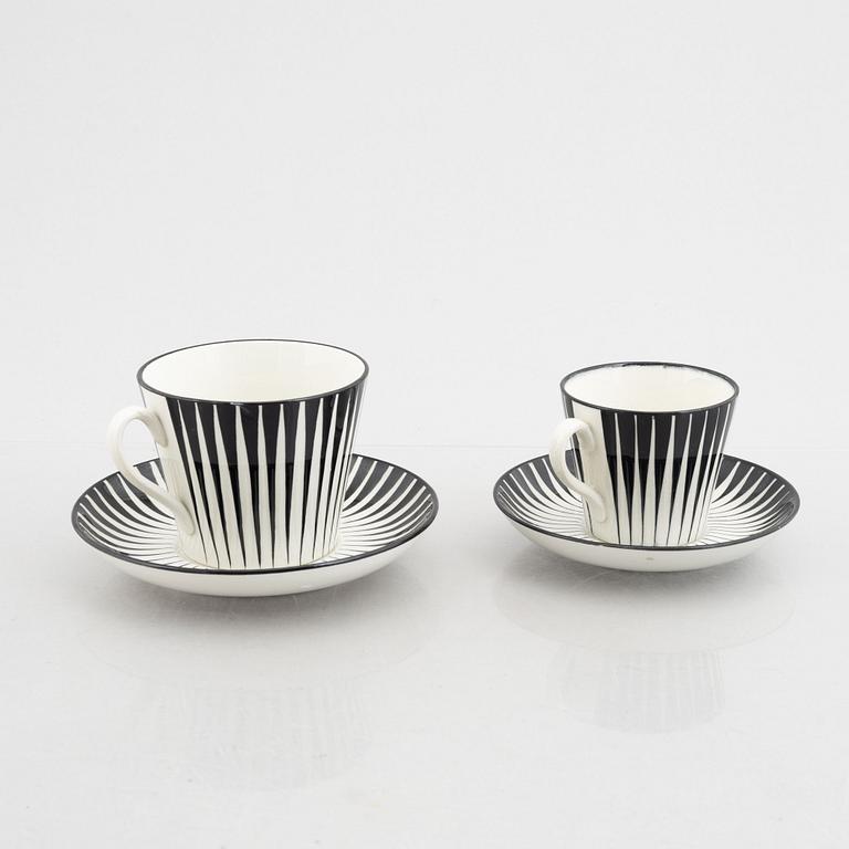 Eugen Trost, three creamware coffee cups with saucers and four tea cups with saucers, "Zebra", Upsala-Ekeby, Sweden.