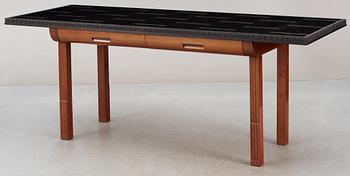 An ebony and pearwood desk / library table, probably executed by cabinetmaker Hjalmar Jackson, Stockholm circa 1934.