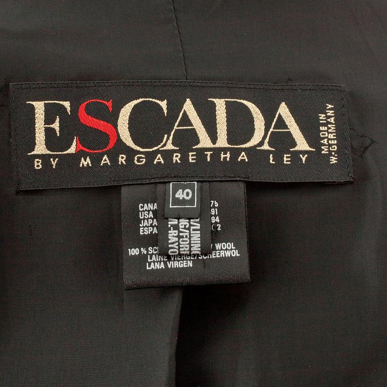 ESCADA, a black wool jacket with decor of gold colored numbers.