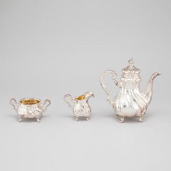 A silver coffee pot, creamer and sugar bowl with swedish import marks, 1930s.