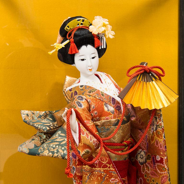 Four late 20th century Japanese dolls.