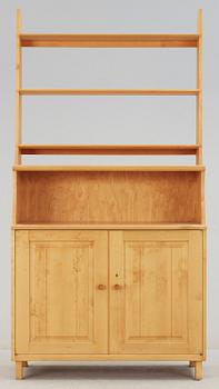 SKÅP MED HYLLA. Carl Malmsten, Åfors Möbelfabrik.