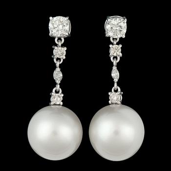 1143. A pair of cultured South sea pearl, app. 15,5 mm, and brilliant cut diamonds, tot. 2.10 cts.