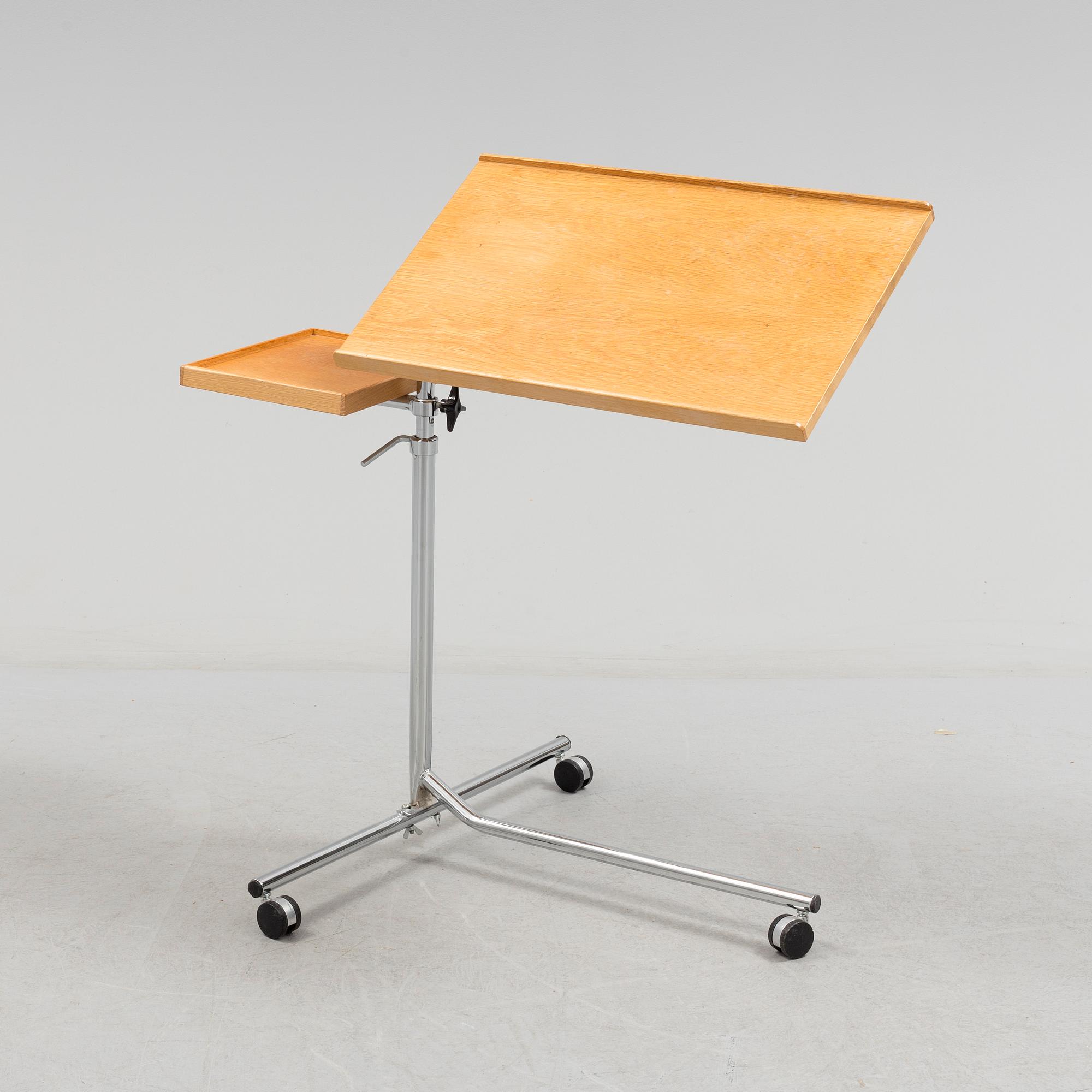 A teak reading table, second half of the 20th Century.