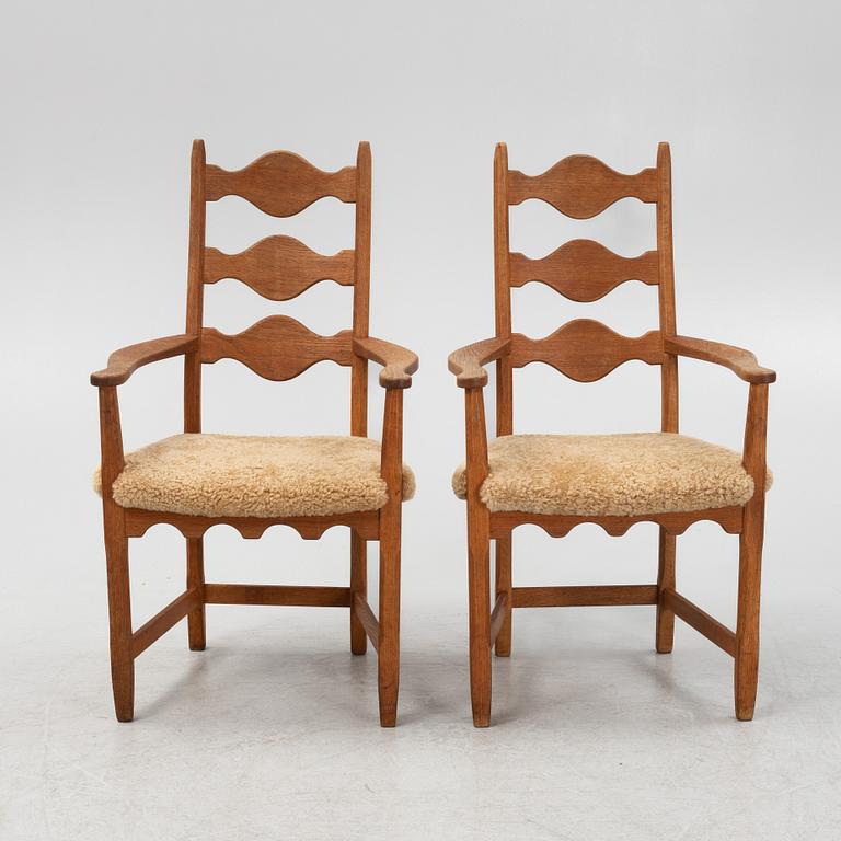 Henning Kjærnulf, a pair of oak 'Razorblade' armchairs with new sheepskin upholstery, from EGK, Demark, 1960s.