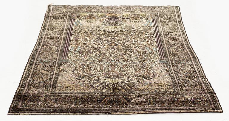 An antique silk Feraghan carpet, c. 195 x 121 cm.