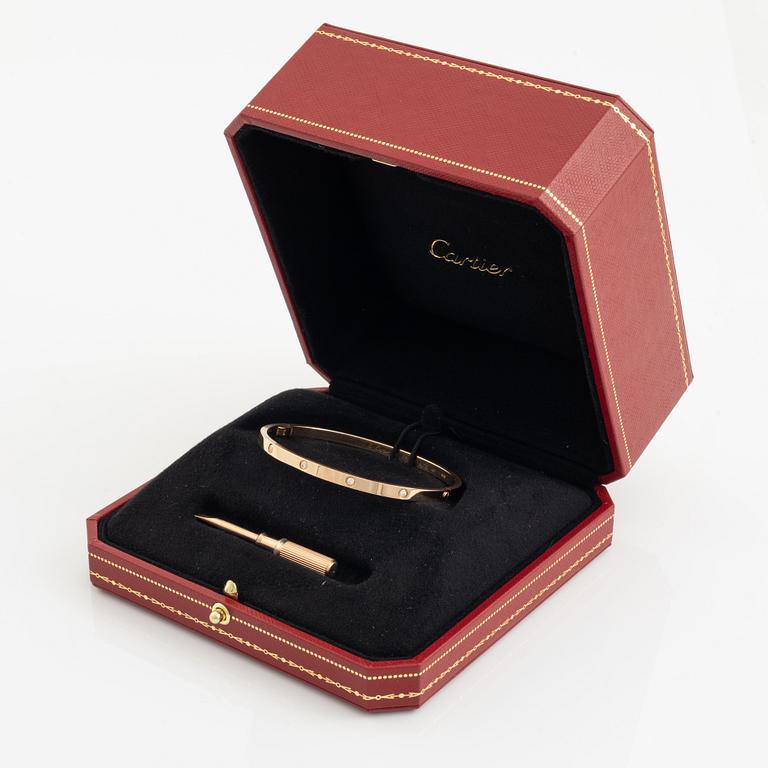 A Cartier "Love" bracelet small model in 18K rose gold with ten round brilliant-cut diamonds.